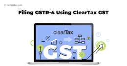 A promotional graphic showing a laptop screen with clearTax GST displayed, surrounded by financial and tax related icons. The main heading reads Filing GSTR-4 Using ClearTax GST indicating the topic of filing GST returns (GSTR-4) through the ClearTax GST platform.